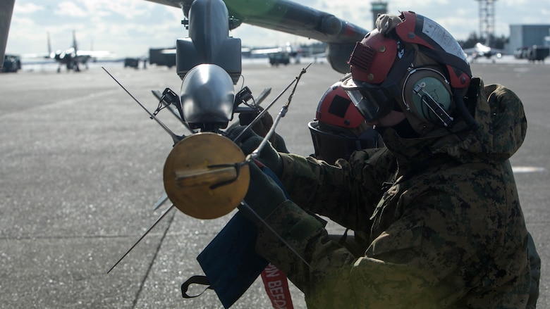 U.S. Marines with Marine Attack Squadron (VMA) 542 conduct preflight inspections during the Aviation Training Relocation Program at Chitose Air Base, Japan, Dec. 8, 2016. During the ATR the Marines with the power line division for VMA-542 have ensured the safety of all aircraft involved through routine flight inspections, launching the aircraft and recovering the aircraft. (U.S. Marine Corps photo by Cpl. James A. Guillory)