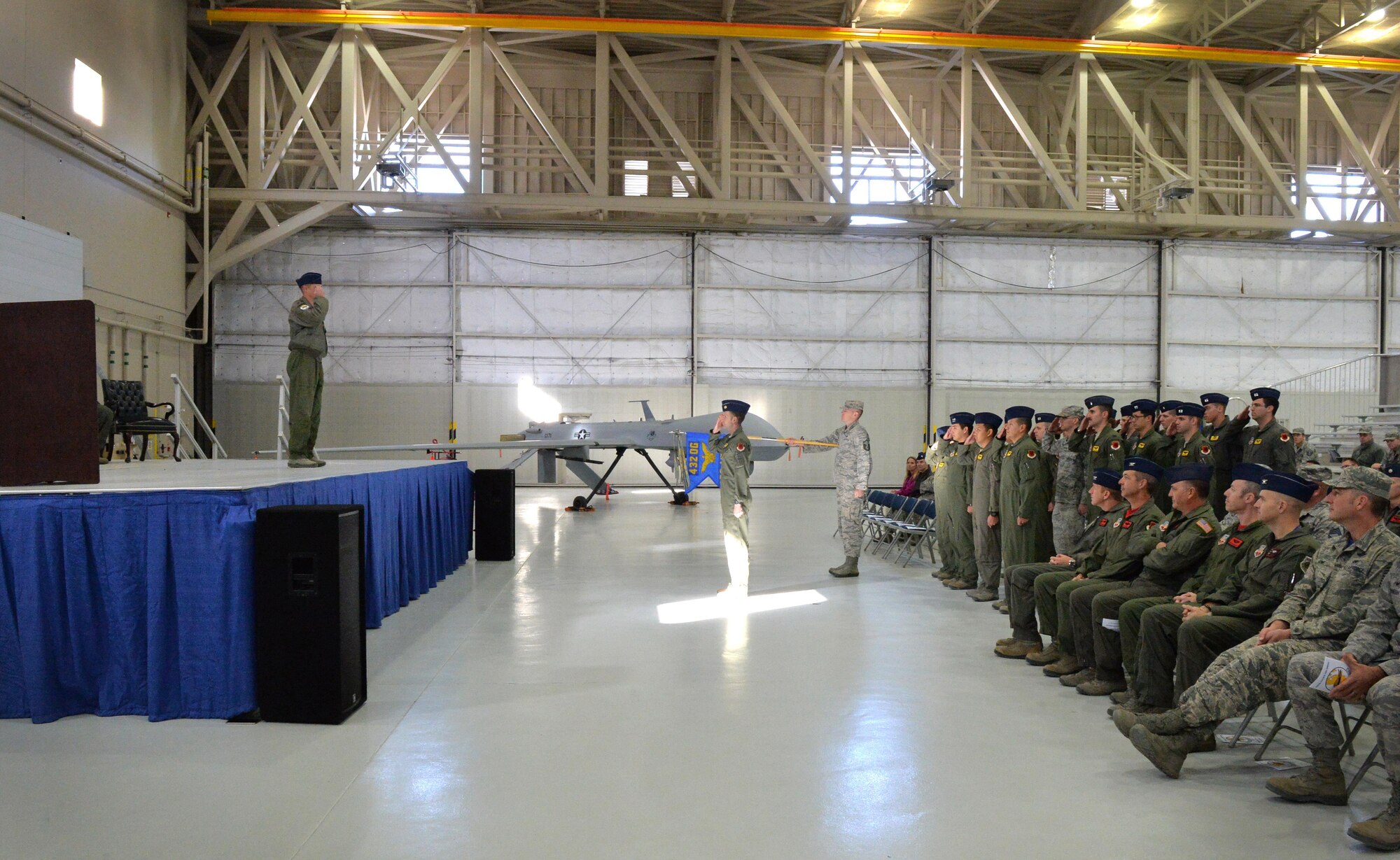 Lt. Col.Theodore receives his first salute after assuming command of the reactivated 489th Attack Squadron Dec. 2, 2016, at Creech Air Force Base, Nev. The unit will assume responsibility of aircraft launch and recovery in deployed environments and operate on a rotational basis. (U.S. Air Force photo/ Airman 1st Class Kristan Campbell)
