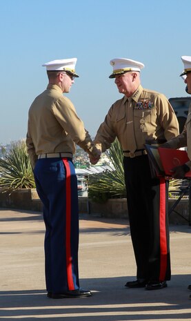 General Glenn M. Walters, Assistant Commandant of the Marine Corps, shakes the hand of a Marine receiving a Superior Achiever Award during Marine Corps Recruiting Command’s Superior Achiever Ceremony at Naval Base Point Loma, Dec. 8. The Superior Achiever Award was established in 1981 to recognize Marine Corps recruiting stations that achieve or exceed specified recruiting goals each fiscal year