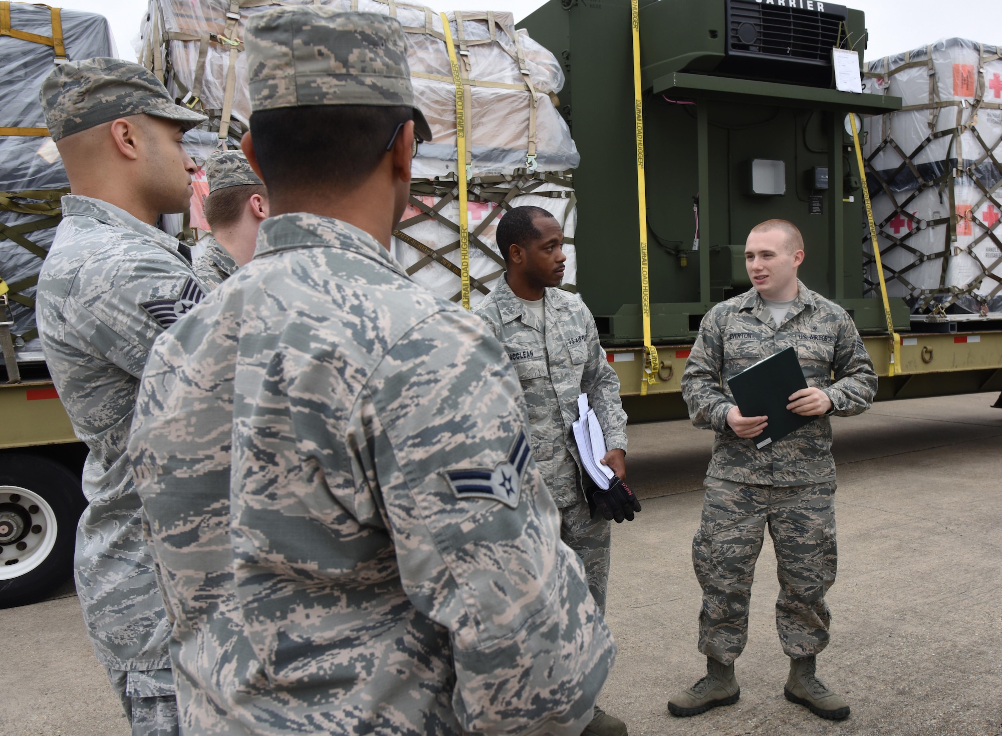 Medical logistics technicians from the 81st Medical Support Squadron participate in a deployment exercise at the supply warehouse loading docks Dec. 7, 2016, on Keesler Air Force Base, Miss. The exercise scenario tested the mission readiness of Team Keesler for simultaneous world-wide deployments. (U.S. Air Force photo by Kemberly Groue)