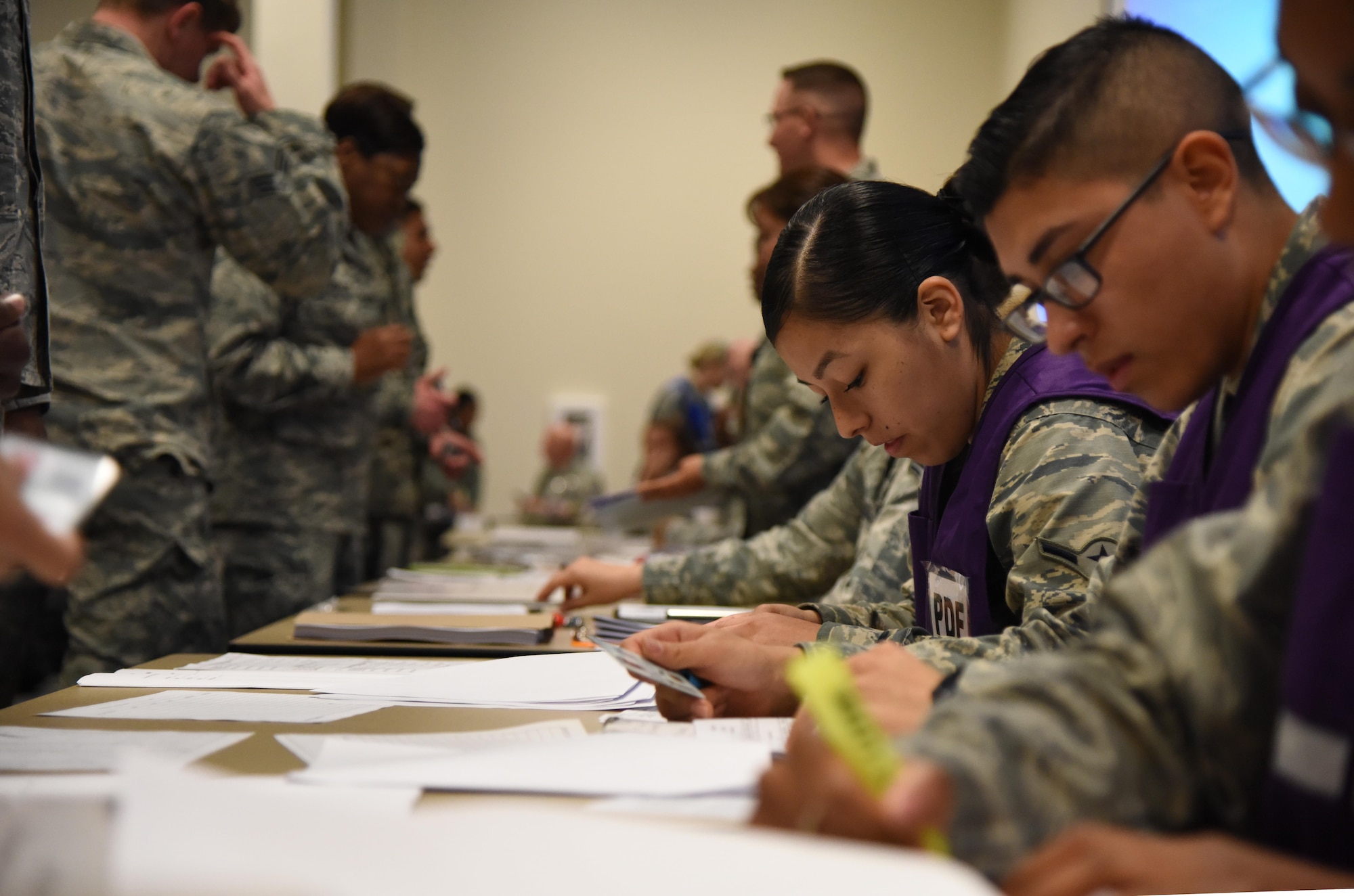 Airman Brenda Prudencio, 81st Force Support Squadron customer support technician, verifies deployment eligibility at the Roberts Consolidated Aircraft Maintenance Facility during a deployment exercise Dec. 8, 2016, on Keesler Air Force Base, Miss. The exercise scenario tested the mission readiness of Team Keesler for simultaneous world-wide deployments. (U.S. Air Force photo by Kemberly Groue)