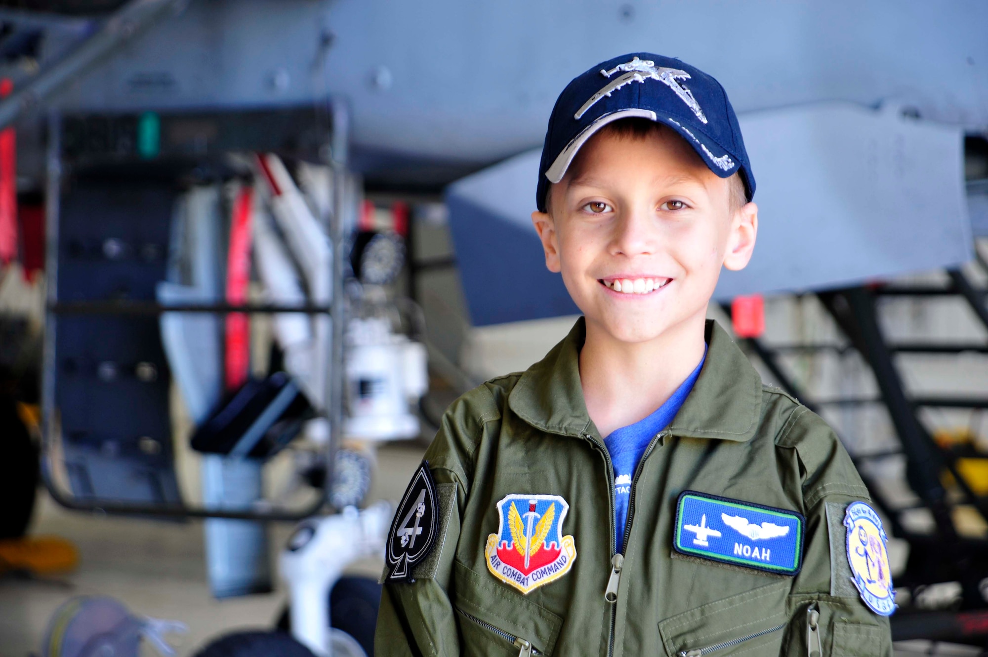 Noah Hepner, 10, smiles for a photo while visiting the 47th Fighter Squadron as part of the “Pilot for a Day” program at Davis-Monthan Air Force Base, Ariz., Dec. 4, 2016. Noah was diagnosed with High Risk Acute Lymphoblastic Leukemia, August 2015. (U.S. Air Force photo by Tech. Sgt. Courtney Richardson)