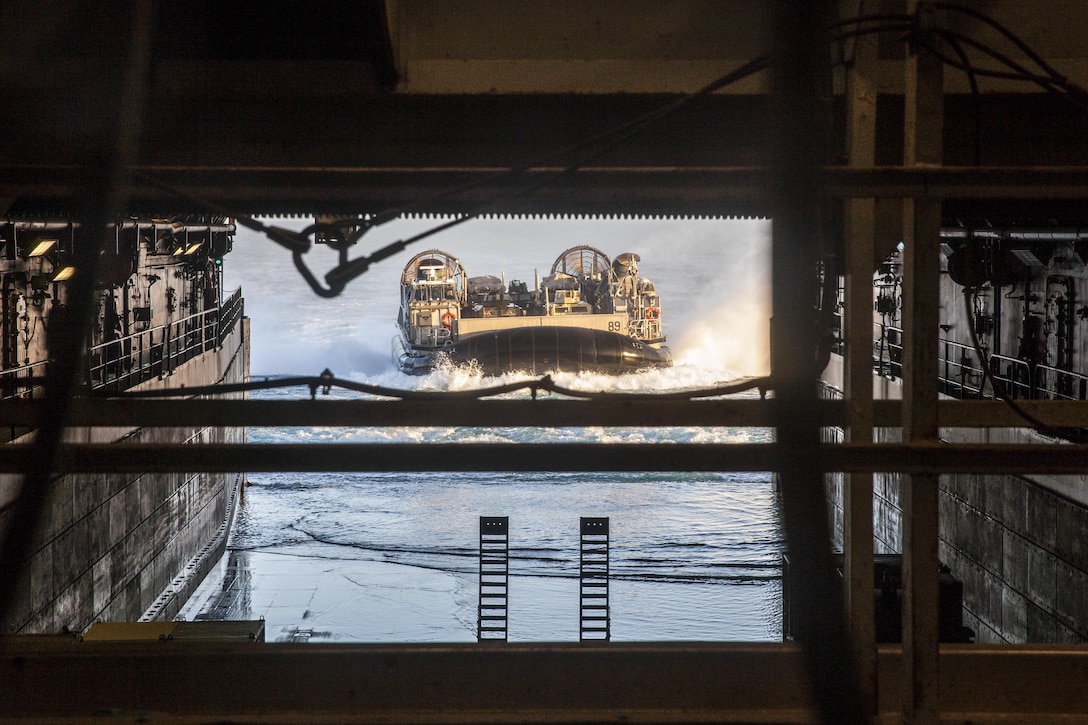 An air-cushion landing craft pulls into the well deck of the USS Mesa Verde during the Amphibious Ready Group Marine Expeditionary Unit Exercise at sea, Dec. 3, 2016. The three-week training evolution aims to enhance interoperability and amphibious warfare capabilities to enable the Navy and Marine Corps to tackle a wide range of operations during their upcoming deployment. Marine Corps photo by Gunnery Sgt. Adaecus G. Brooks
