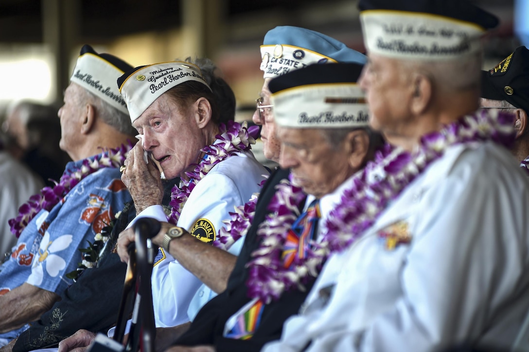 Pearl Harbor survivor Jack Holder wipes away tears during a 75th commemoration event of the attacks on Pearl Harbor at Joint Base Pearl Harbor-Hickam, Hawaii, Dec. 7, 2016. The U.S. military co-hosted the event, which, provided veterans, service members and the community a chance to honor the sacrifices made by those who were present during the attacks. Navy photo by Petty Officer 1st Class Rebecca Wolfbrandt