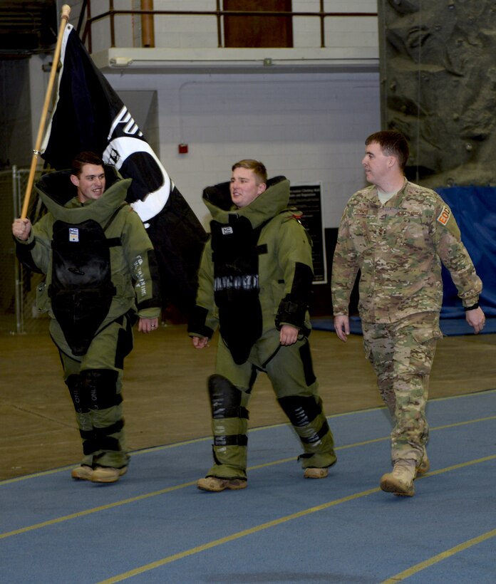Explosive ordinance technicians from the 28th Civil Engineer Squadron carry the Prisoner of War/Missing in Action flag during the second annual POW/MIA 24-hour run at Ellsworth Air Force Base, S.D., Dec. 6 to 7, 2016. The run, which started and ended in the Pride Hangar, honored 12 individuals from all of the world’s major conflicts over the last 75 years, including World War II, Korea, Vietnam, the Gulf War, and one officer who was detained in Iran. (U.S. Air Force photo by Airman 1st Class Denise M. Jenson)