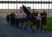 Members from the 28th Contracting and Comptroller Squadrons participate in the second annual Prisoner of War/Missing in Action 24-hour run at Ellsworth Air Force Base, S.D., Dec. 6 to 7, 2016. Participants ran in 30 minute shifts while carrying the POW/MIA flag as a way to honor and remember those who did not make it home. (U.S. Air Force photo by Airman 1st Class Denise M. Jenson)