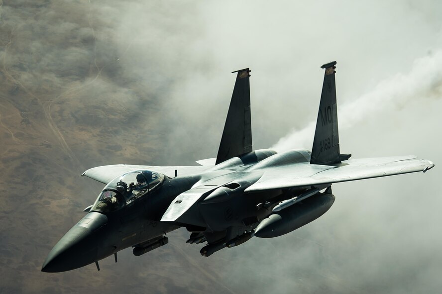 A F-15E Strike Eagle disconnects from a KC-10 Extender after receiving fuel over Iraq Dec. 5, 2016. F-15s are providing precision guided close air support during Combined Joint Task Force-Operation Inherent Resolve, a multinational effort to weaken and destroy the Islamic State in Iraq and the Levant operations in the Middle East region and around the world. (U.S. Air Force photo/Senior Airman Tyler Woodward)