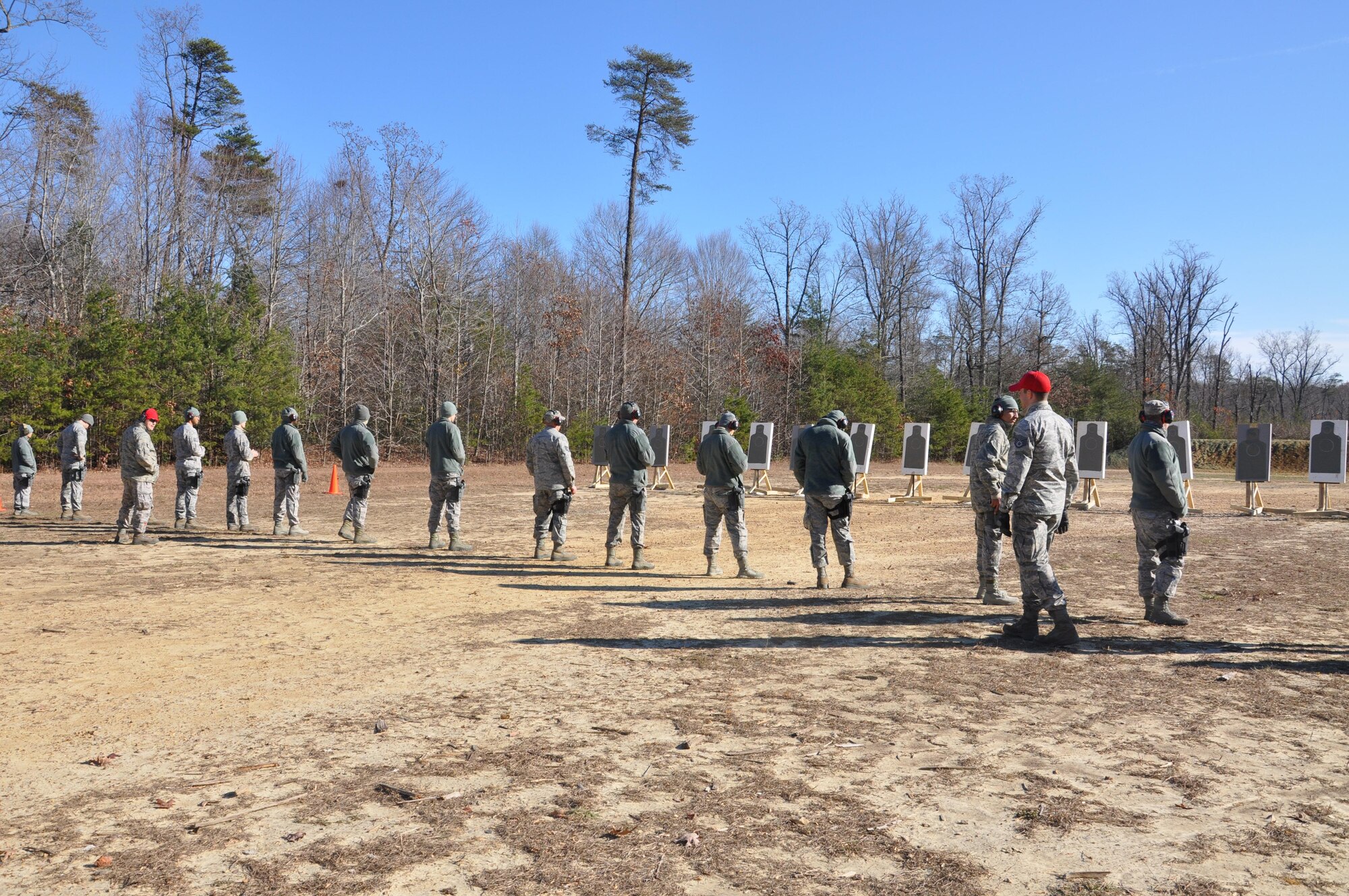 Members of the 459th Security Forces Squadron wait for firing commands at a Marine Corps Base Quantico, Virginia, firing range Dec. 3, 2016. More than 150 459th SFS members traveled from Joint Base Andrews, Maryland, to Quantico to train on the M4 assault rifle and M9 handgun. (U.S. Air Force photo/Senior Airman Kristin Kurtz)