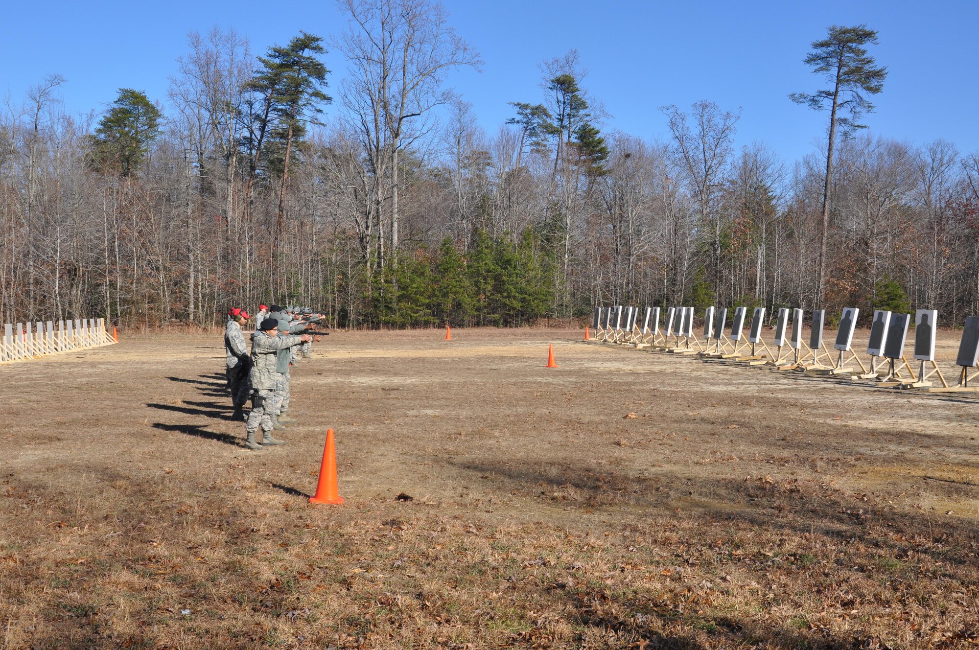 Members of the 459th Security Forces Squadron fire M9 handguns at targets at a Marine Corps Base Quantico, Virginia, firing range Dec. 3, 2016. More than 150 459th SFS members traveled from Joint Base Andrews, Maryland, to Quantico to train on the M4 assault rifle and M9 handgun. (U.S. Air Force photo/Senior Airman Kristin Kurtz)