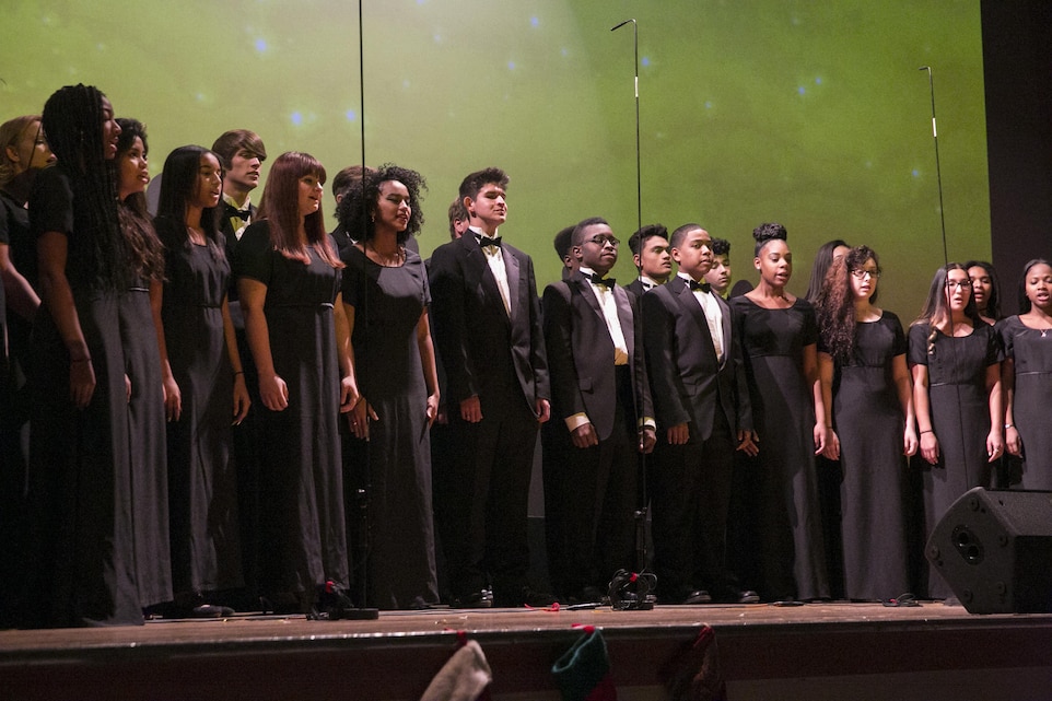 The Twentynine Palms High School Select Choir performs during the Combat Center Holiday Show at Sunset Cinema aboard Marine Corps Air Ground Combat Center, Twentynine Palms, Calif., Nov. 3, 2016. (Official Marine Corps photo by Lance Cpl. Dave Flores/Released)