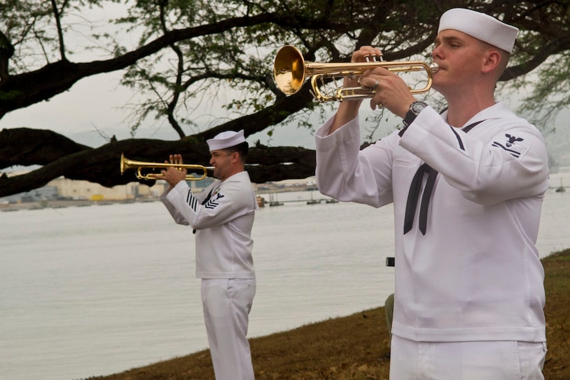 Navy Petty Officer 1st Class Brandon Barbee and Navy Petty Officer 2nd Class Rick Baty perform at the remembrance ceremony for the crew members of the USS Nevada killed in the attack on Pearl Harbor, at Joint Base Pearl Harbor-Hickam, Hawaii, Dec. 8, 2016. Seventy-six men died of wounds from the surprise Japanese attack. DoD photo by Lisa Ferdinando