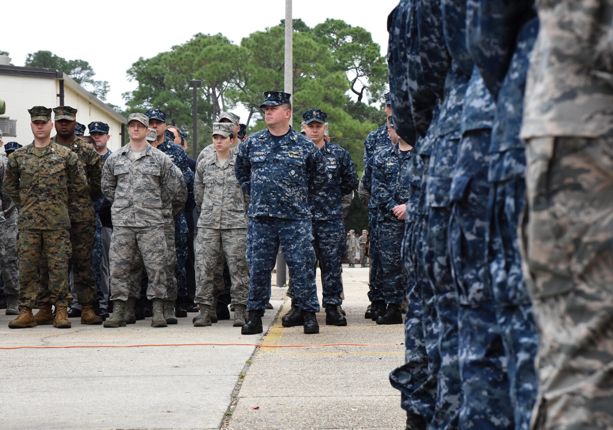 Keesler personnel attend a Center for Naval Aviation Technical Training Unit Keesler Pearl Harbor 75th Anniversary Remembrance Ceremony in front of Allee Hall Dec. 7, 2016, on Keesler Air Force Base, Miss. More than 100 Keesler personnel attended the event to honor those lost in the Dec. 7, 1941 Pearl Harbor attacks. (U.S. Air Force photo by Kemberly Groue)