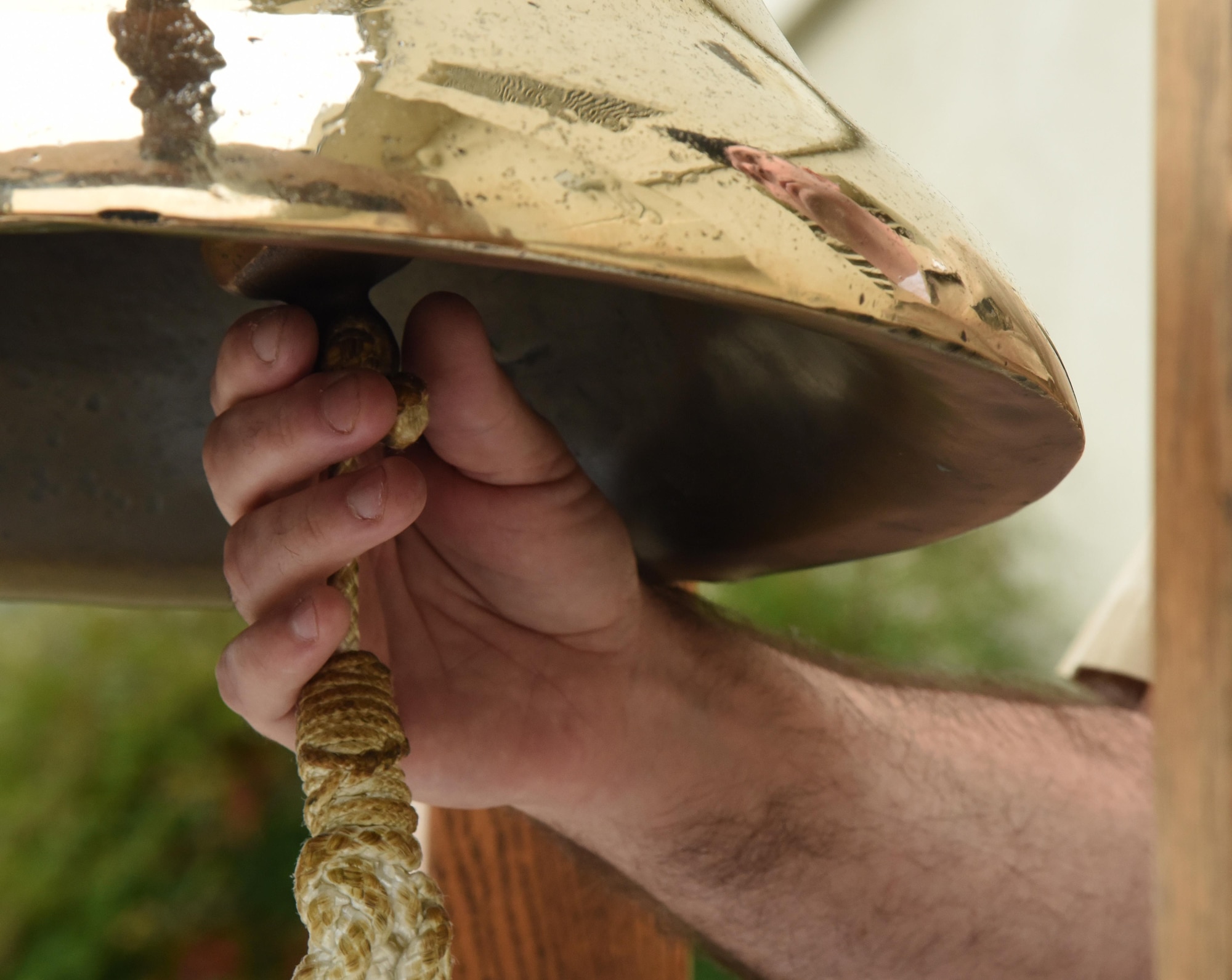 U.S. Navy Petty Officer 1st Class James Rogers, Center for Naval Aviation Technical Training Unit Keesler instructor, rings a bell in memory of every ship destroyed during the attacks on Pearl Harbor at a CNATTU Keesler Pearl Harbor 75th Anniversary Remembrance Ceremony in front of Allee Hall Dec. 7, 2016, on Keesler Air Force Base, Miss. More than 100 Keesler personnel attended the event to honor those lost in the Dec. 7, 1941 Pearl Harbor attacks. (U.S. Air Force photo by Kemberly Groue)