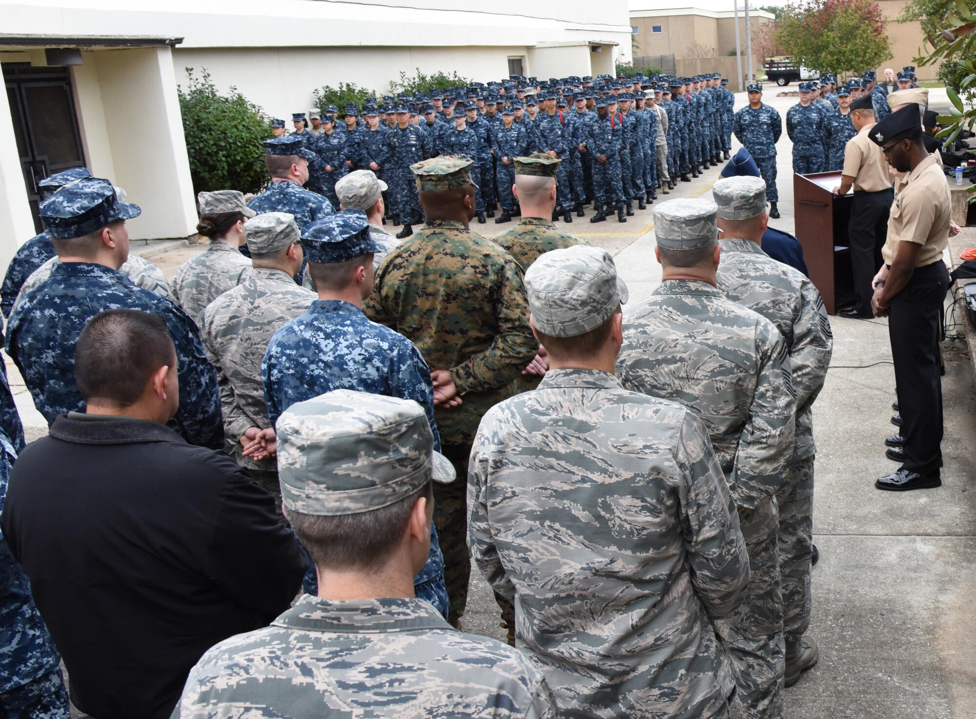 Keesler personnel attend a Center for Naval Aviation Technical Training Unit Keesler Pearl Harbor 75th Anniversary Remembrance Ceremony in front of Allee Hall Dec. 7, 2016, on Keesler Air Force Base, Miss. More than 100 Keesler personnel attended the event to honor those lost in the Dec. 7, 1941 Pearl Harbor attacks. (U.S. Air Force photo by Kemberly Groue)