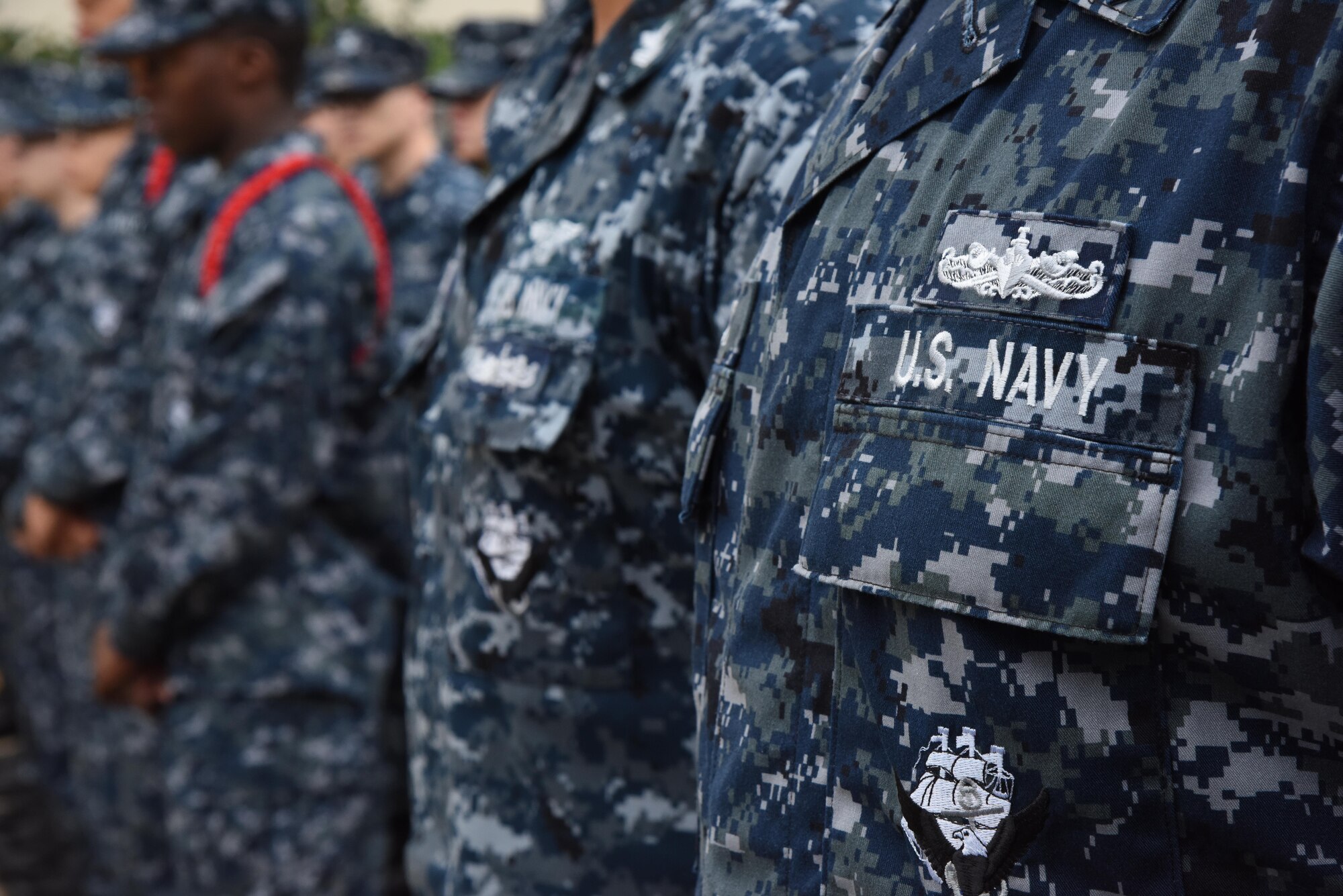 Keesler personnel attend a Center for Naval Aviation Technical Training Unit Keesler Pearl Harbor 75th Anniversary Remembrance Ceremony in front of Allee Hall Dec. 7, 2016, on Keesler Air Force Base, Miss. More than 100 Keesler personnel attended the event to honor those lost in the Dec. 7, 1941 Pearl Harbor attacks. (U.S. Air Force photo by Kemberly Groue)