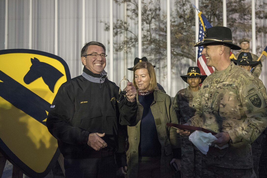 Soldiers assigned to the 1st Cavalry Division induct Defense Secretary Ash Carter into the Order of the Spurs as an honorary member at Bagram Airfield, Afghanistan, Dec. 9, 2016. DoD photo by Air Force Tech. Sgt. Brigitte N. Brantley