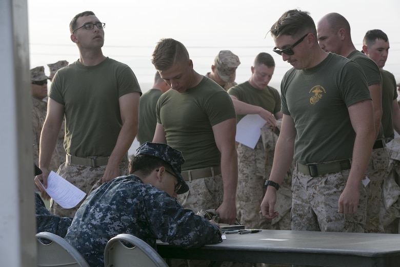 Marines finish their screen process before receiving their influenza vaccine during the Naval Hospital Twentynine Palms point of dispensing exercise at building 1661, Nov. 6, 2016. The exercise trains the corpsman on how to quickly and efficiently distribute vaccines during a pandemic. (Official Marine Corps photo by Cpl. Thomas Mudd/Released)