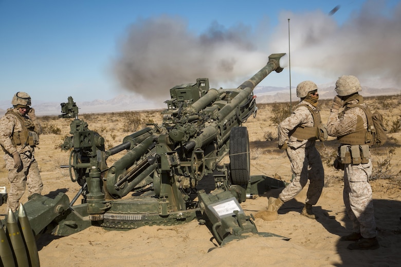 Marines with Battery K, 3rd Battalion, 11th Marine Regiment, fire an M777A2 Howitzer in the Acorn Training Area aboard the Marine Corps Air Ground Combat Center, Twentynine Palms, Calif., Dec. 2, 2016, during preparation for the regiment’s “Top Gun” competition. (Official Marine Corps photo by Cpl. Levi Schultz/Released)