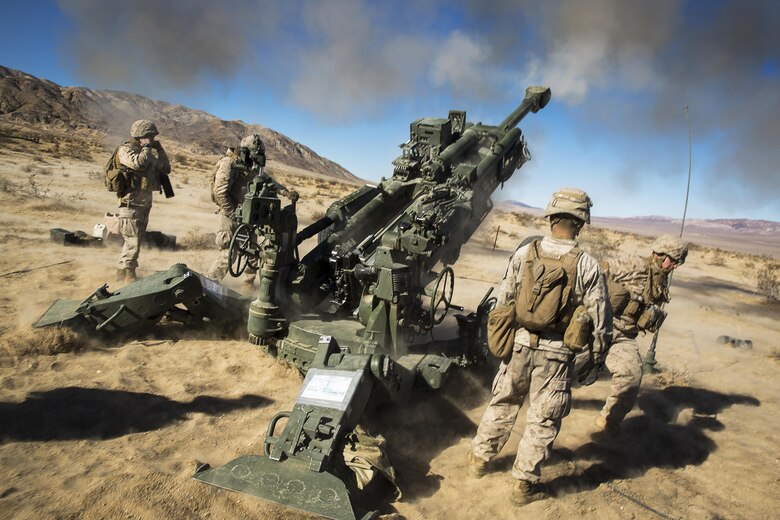 Marines with Battery K, 3rd Battalion, 11th Marine Regiment, fire an M777A2 Howitzer in the Quackenbush Training Area aboard the Marine Corps Air Ground Combat Center, Twentynine Palms, Calif., Dec. 3, 2016, during the regiment’s “Top Gun” competition. (Official Marine Corps photo by Cpl. Levi Schultz/Released)