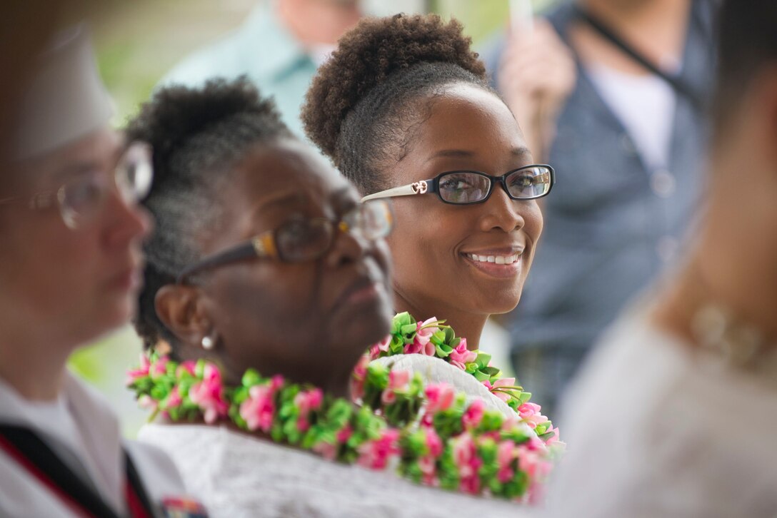 Ginger Knowles with the Alpha Kapp Alpha Sorority looks out from the crowd during the ceremony to rededicate a plaque named after Navy Mess Attendant Second Class Doris "Dorie" Miller, Honolulu, Hawaii, Dec. 8, 2016. DoD photo by Lisa Ferdinando