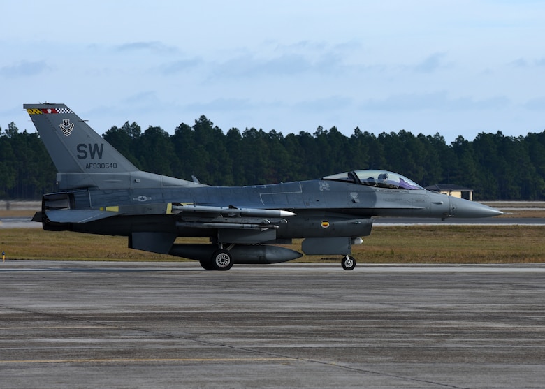 A U.S. Air Force F-16 Fighting Falcon assigned to the 20th Fighter Wing, Shaw Air Force Base, S.C., taxis down the flightline at Tyndall Air Force Base, Fla., Dec. 8, 2016. The Fighting Falcons from Shaw AFB came to Tyndall in support of Checkered Flag 17-1 and Combat Archer 17-3, concurrent exercises that allow fourth and fifth-generation aircraft the opportunity to train alongside one another. (U.S. Air Force photo by Airman 1st Class Isaiah J. Soliz/Released)
