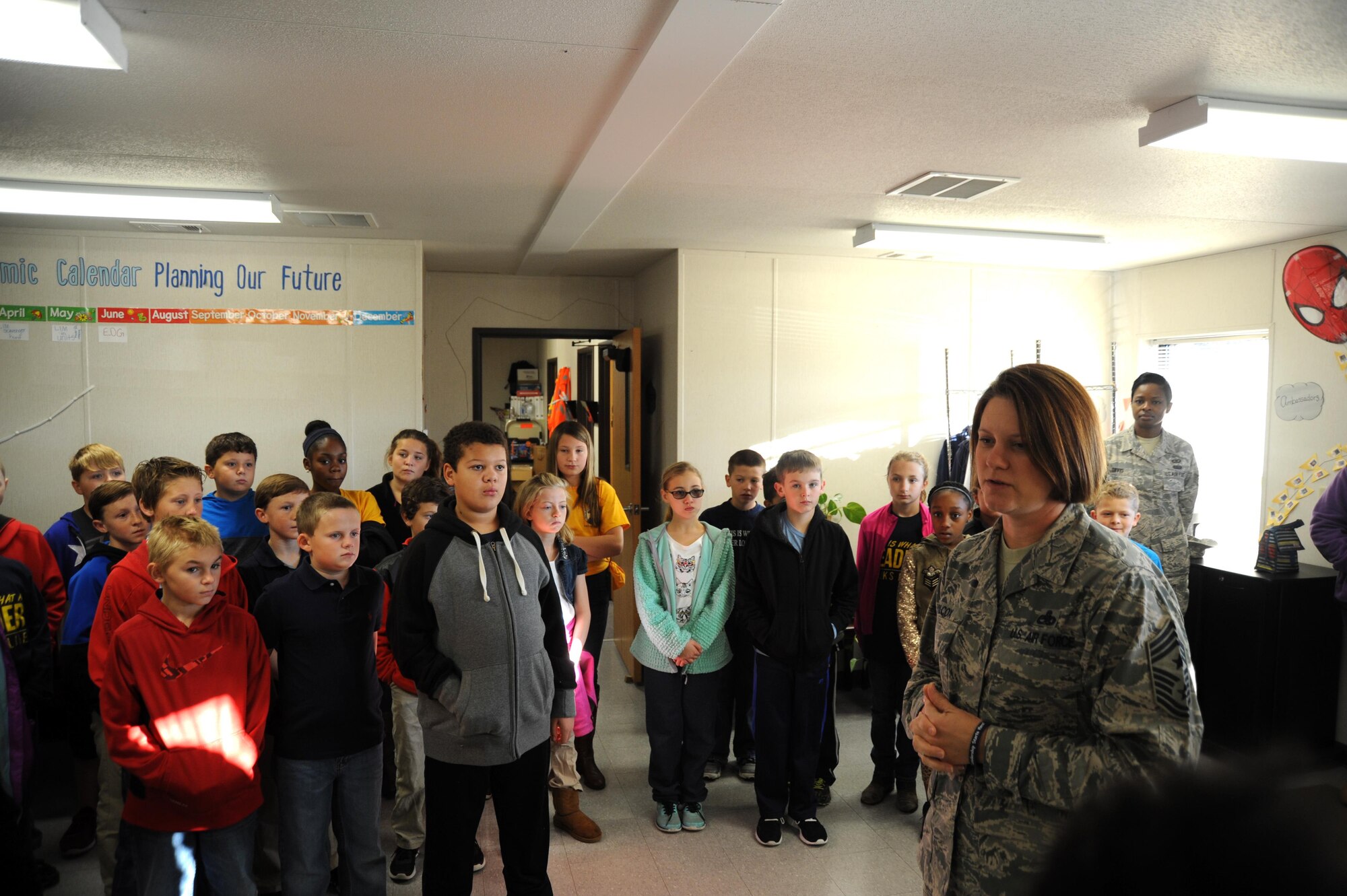Command Chief Master Sgt. Shirley Wilcox, 916th Air Refueling Wing command chief, thanks students at Wayne Preparatory Academy for the care packages they prepared on Dec. 2, 2016, in Goldsboro, North Carolina. (U.S. Air Force photo by Senior Airman Jeramy Moore/released)