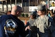 Command Chief Master Sgt. Shirley Wilcox, 916th Air Refueling Wing command chief greets Dr. Todd Forgette, principal of Wayne Preparatory Academy on Dec. 2, 2016, in Goldsboro, North Carolina. Members of Team Seymour went to Wayne Preparatory Academy to pick up care packages that the students and faculty prepared for deployed Airmen. (U.S. Air Force photo by Senior Airman Jeramy Moore/released)