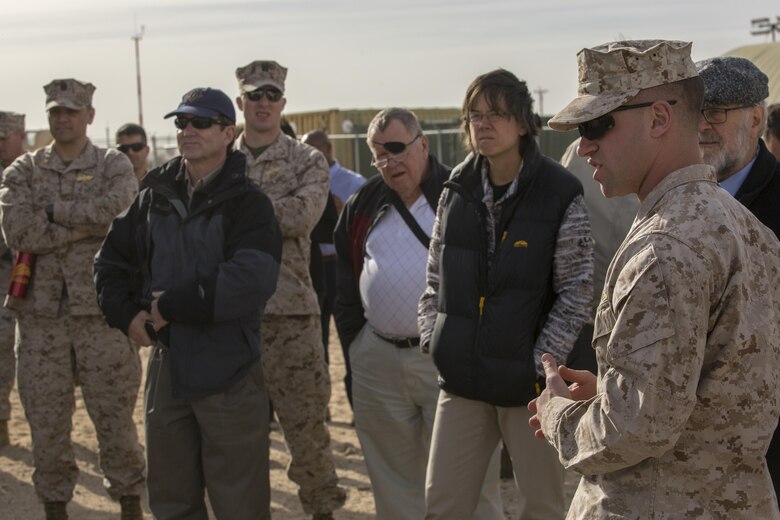 Capt. Michael Herendeen, science and technology analyst, Marine Corps Expeditionary Energy Office, explains different efforts and technologies the Marine Corps has developed during the Energy Capability Exercise, in alignment with the Great Green Fleet initiative, at Camp Wilson aboard the Marine Corps Air Ground Combat Center, Twentynine Palms, Calif., Dec. 6, 2016. (Official Marine Corps photo by Cpl. Levi Schultz/Released)