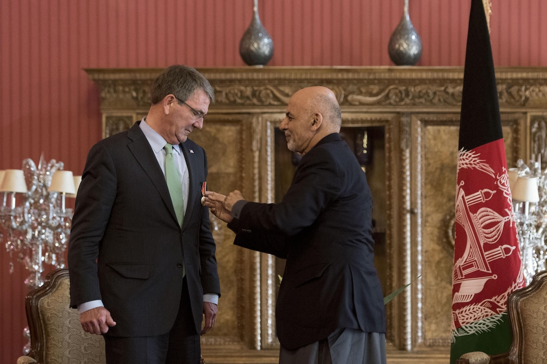 Afghan President Ashraf Ghani presents Defense Secretary Ash Carter with the Amir Amanullah Khan medal, Afghanistan's highest civilian award, in Kabul, Afghanistan, Dec. 9, 2016. DoD photo by Air Force Tech. Sgt. Brigitte N. Brantley