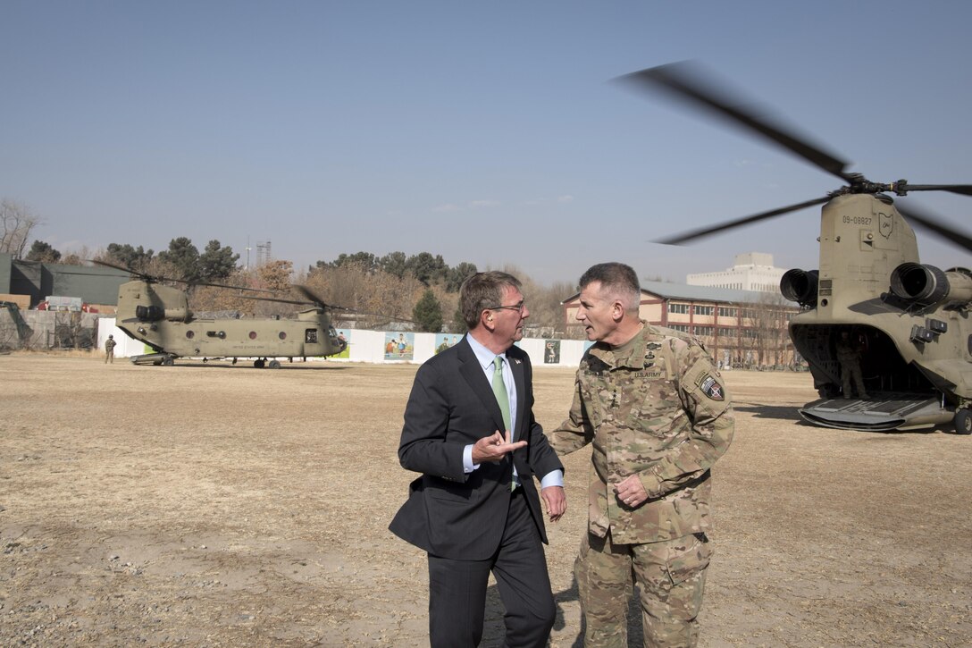 Defense Secretary Ash Carter talks with Army Gen. John Nicholson, commander of Resolute Support and U.S. Forces Afghanistan, after arriving at the Resolute Support headquarters.