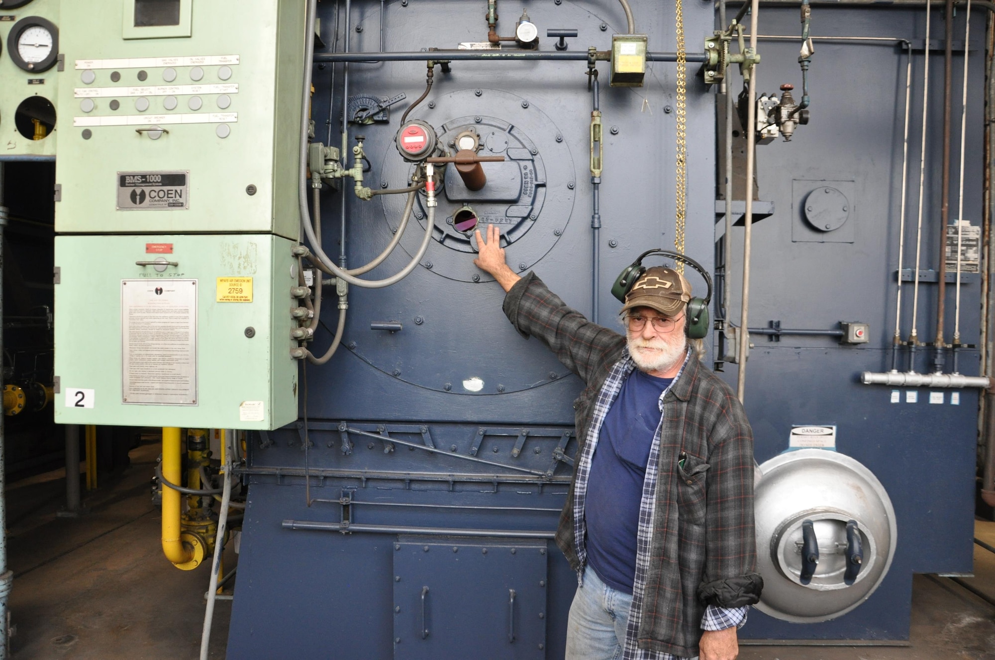 Bill Livesay, Boiler Plant supervisor, inspects one of the big boilers at Wright-Patterson Air Force Base. (U.S. Air Force photo/W. Eugene Barnett Jr.)