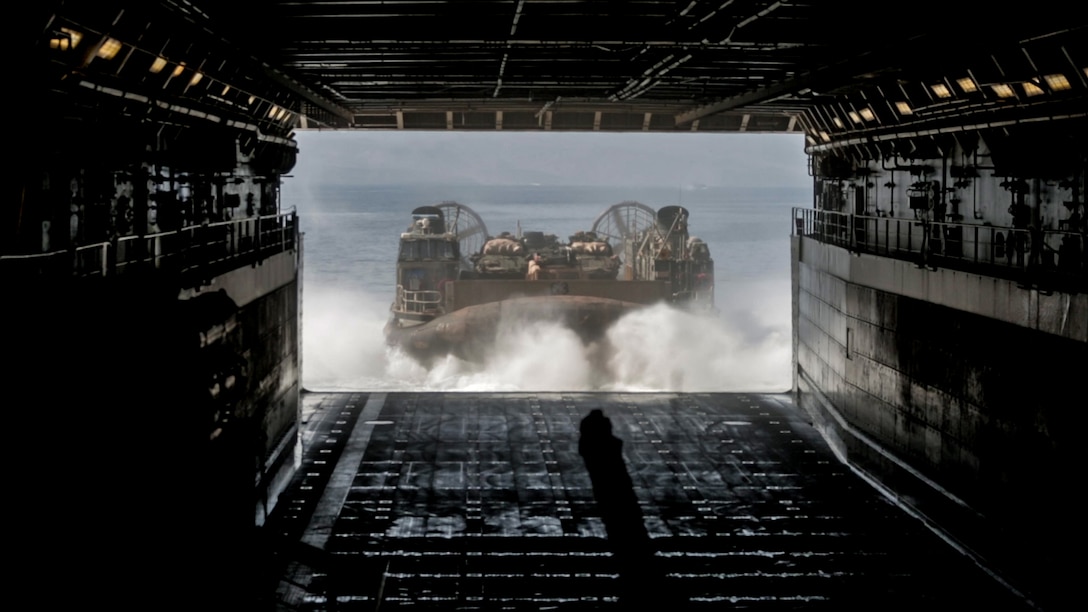 GULF OF ADEN (Dec. 6, 2016) A landing craft air cushion (LCAC) debarks from the stern gate of the USS Somerset (LPD 25) caring U.S. Marines and their light armored vehicles during an amphibious assault rehearsal as part of exercise Alligator Dagger, Dec. 6, 2016. The LCAC is one means for an amphibious ready group and a Marine expeditionary unit to conduct logistical movements, carrying troops, vehicles, and equipment from ship to shore. The Makin Island Amphibious Ready Group and the 11th MEU is operating in the U.S. 5th Fleet area of responsibility in support of maritime security operations and theater security cooperation efforts to ensure the free flow of commerce, freedom of navigation and regional security. (U.S. Marine Corps photo by Lance Cpl. Zachery C. Laning)