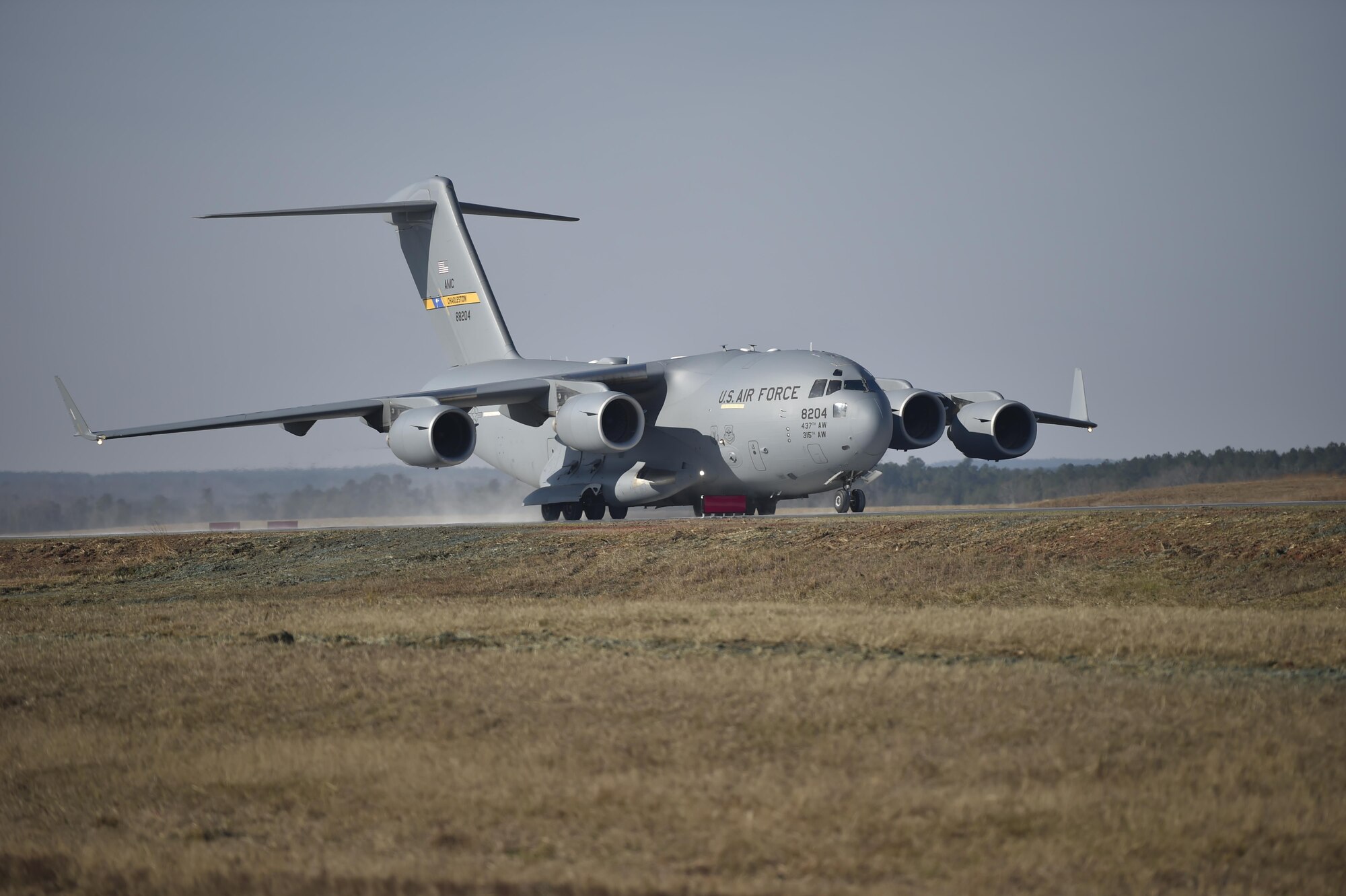 A C-17 Globemaster III performs air assault landing training at North Auxiliary Airfield in North, South Carolina, Dec. 8, 2016. The training marked the completion of a six-month runway repair project. 