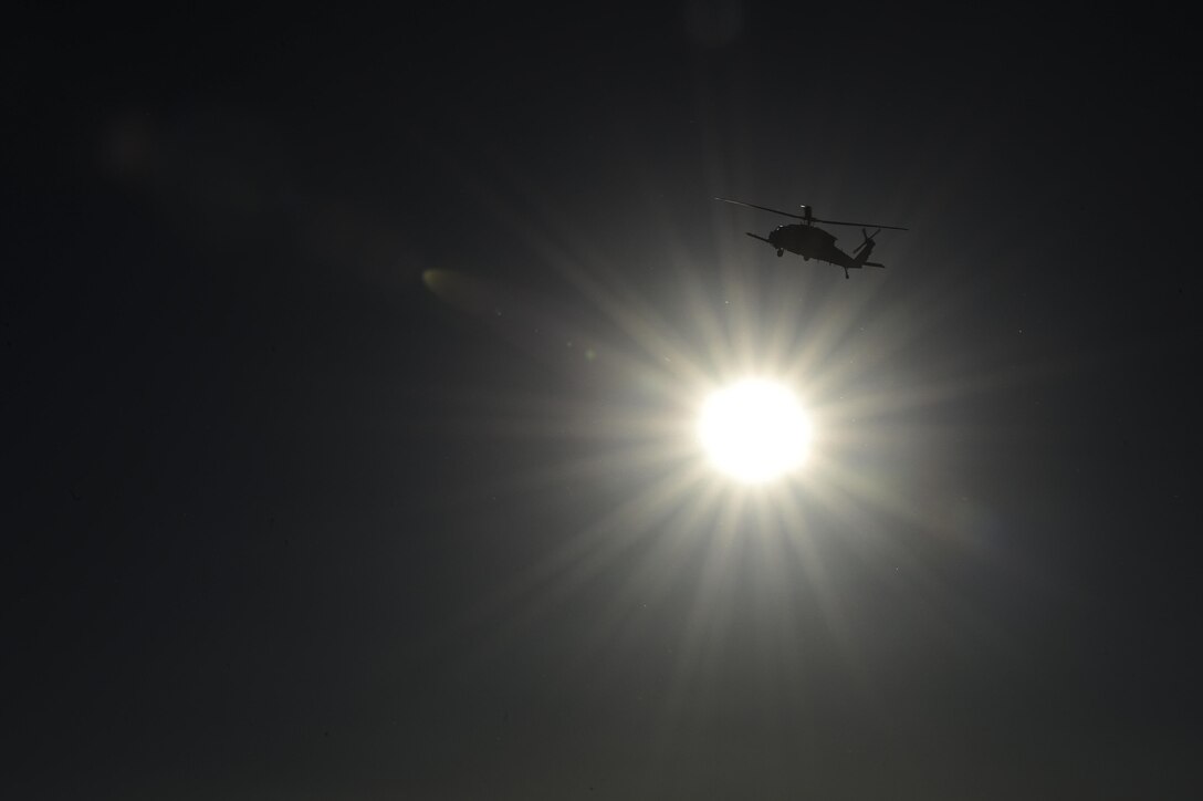 An HH-60G Pave Hawk from the 55th Rescue Squadron orbits a simulated crash site during a mass casualty exercise at Fort Huachuca, Ariz., Dec. 8, 2016. Pararescuemen from the 48th Rescue Squadron were air dropped into the crash site where they treated and evacuated survivors. (U.S. Air Force photo by Senior Airman Chris Drzazgowski)