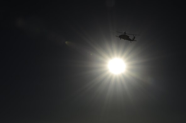 An HH-60G Pave Hawk from the 55th Rescue Squadron orbits a simulated crash site during a mass casualty exercise at Fort Huachuca, Ariz., Dec. 8, 2016. Pararescuemen from the 48th Rescue Squadron were air dropped into the crash site where they treated and evacuated survivors. (U.S. Air Force photo by Senior Airman Chris Drzazgowski)