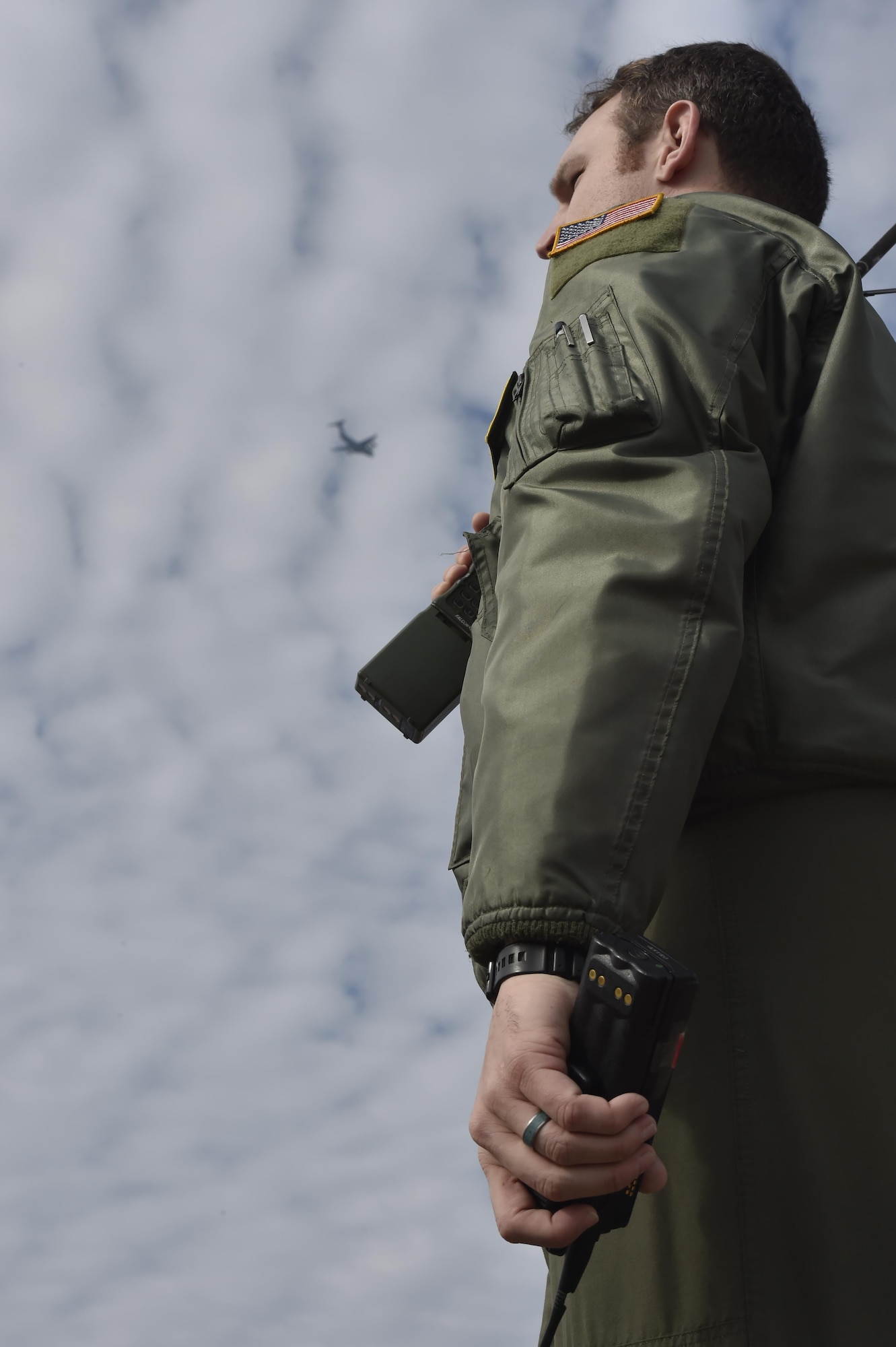 Capt. Caleb Morris, 14th Airlift Squadron pilot, watches as a C-17 Globemaster III performs air assault landing training at North Auxiliary Airfield in North, South Carolina, Dec. 8, 2016. North Auxiliary Airfield, a training facility geographically separated from Joint Base Charleston, is used for various types of flight training. 