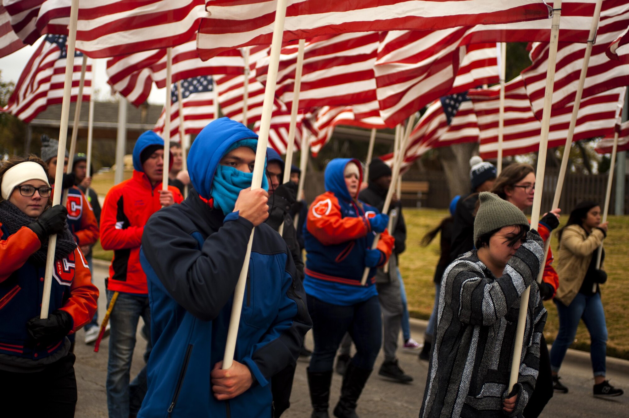 Central High School students bear flags during the Heroes Hunt Parade at Santa Fe Park in San Angelo, Texas, Dec. 8, 2016. San Angelo hosts the Hero’s Hunt Parade for veterans from all over Texas to honor them for their service. (U.S. Air Force photo by Senior Airman Scott Jackson/released)