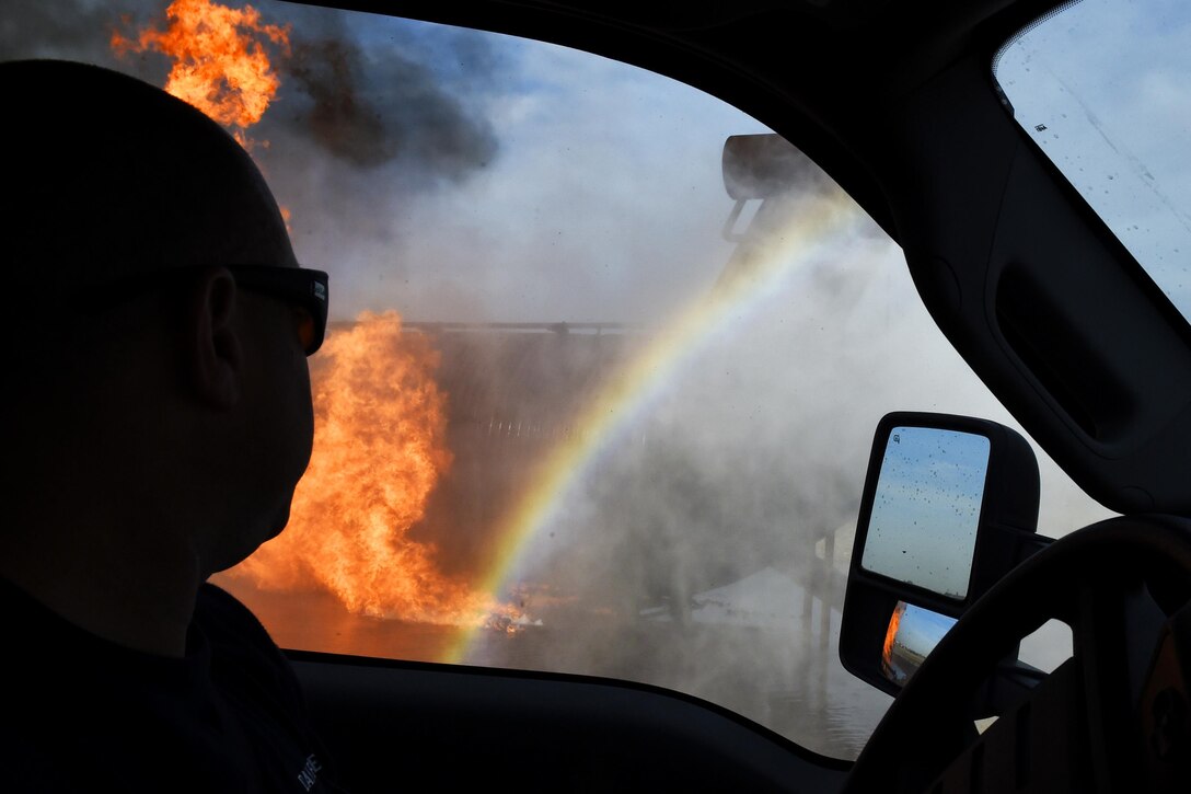A firefighter uses a rapid intervention vehicle to respond to an aircraft fire during training Dec. 7, 2016, at Luke Air Force Base, Ariz., Dec. 7, 2016. Firefighters assigned to the 56th Civil Engineer Squadron and Gila Bend Fire Department conducted the training. Air Force photo by Senior Airman James Hensley