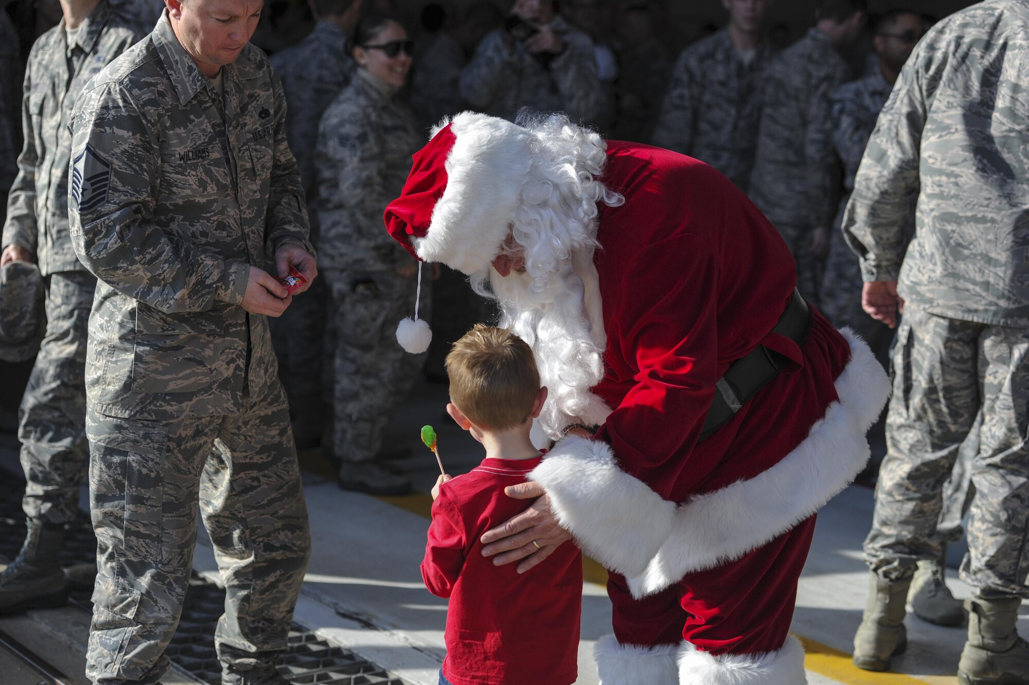 A child talks to Santa Claus at the 940th Air Refueling Wing’s holiday party Dec. 3, 2016, at Beale Air Force Base, California. Santa Claus visited with members of the wing and their families. (Air Force Photo by Airman Tristan D. Viglianco)
