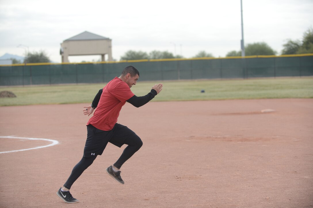 Staff Sgt. Mario Valenzuela, 56th Communications Squadron client systems technition, sprints to the next obstacle during the Winter Games Dec. 6, 2016 at Luke Air Force Base, Ariz. The Winter Games is a friendly competition between squadrons to improve moral and comradery.  (U.S. Air Force photo by Airman First Class Alexander Cook)
