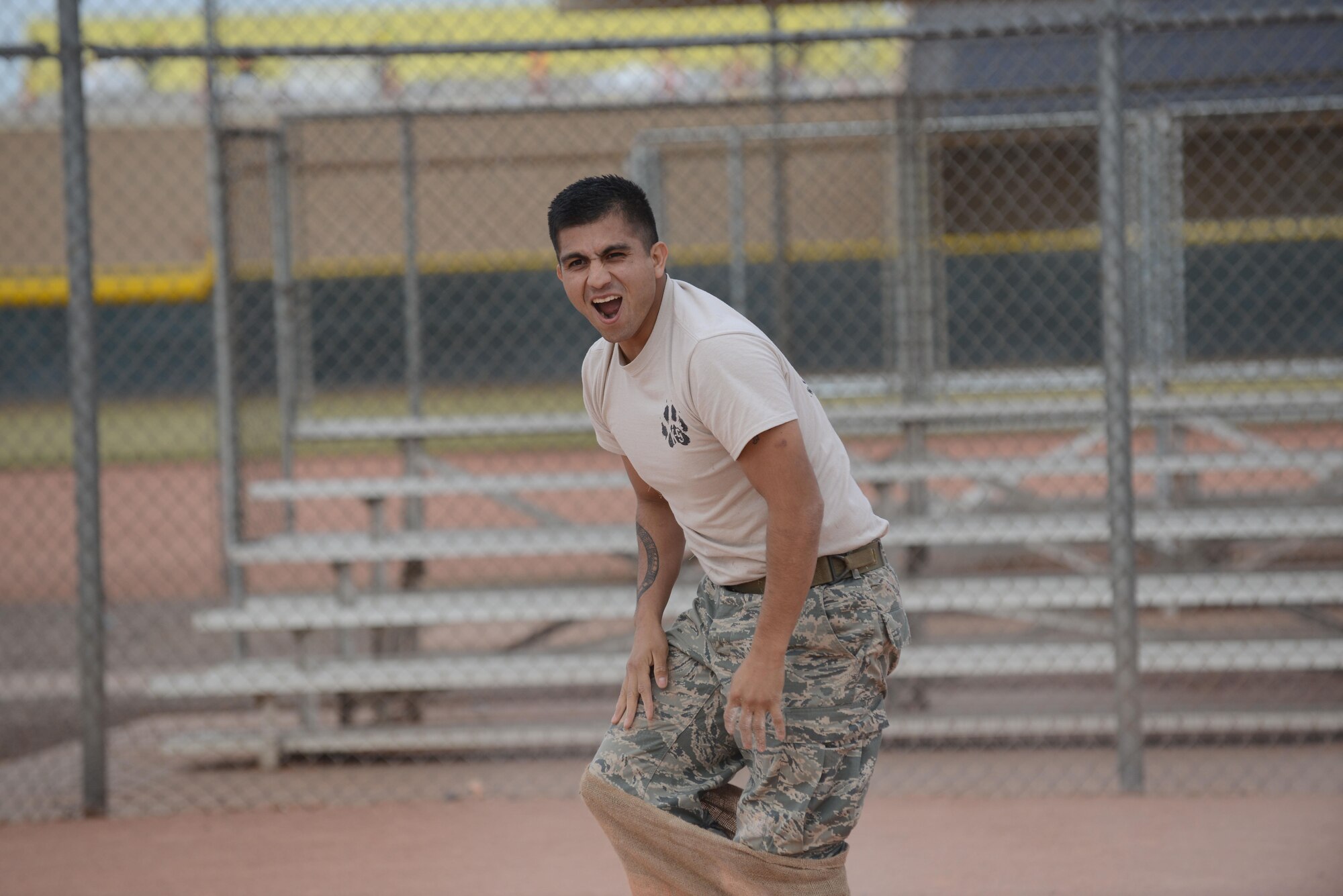 Staff Sgt. Adrian Cook, 56th Security Forces Squadron military working dog handler, celebrates after completing the obstacle course Dec. 6, 2016 at Luke Air Force Base, Ariz. The Winter Games is a friendly competition between squadrons to improve moral and comradery. (U.S. Air Force photo by Airman First Class Alexander Cook)