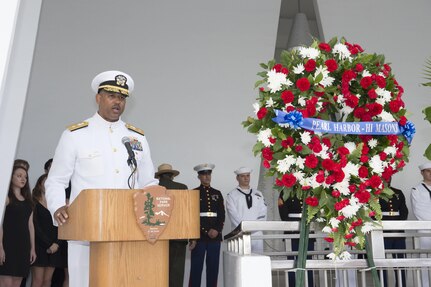 161207-N-ZK021-033 PEARL HARBOR (Dec. 7, 2016) Rear Adm. John Fuller, commander, Navy Region Hawaii and Naval Surface Group Middle Pacific gives his opening remarks during a memorial ceremony and interment service for John D. Anderson, boatswain’s mate 2nd class and Clarendon R. Hetrick, seaman first class at the Arizona Memorial. The 75th commemoration of the attack on Pearl Harbor and Oahu, co-hosted by the U.S. military, the National Park Service and the State of Hawaii, provided veterans family members, service members and the community a chance to honor the sacrifices made by those who were present Dec. 7, 1941, as well as throughout the Pacific theater. Since the attacks, the U.S. and Japan have endured more than 70 years of continued peace, a cornerstone of security and prosperity in the Indo-Asia-Pacific region. As a Pacific nation, the U.S. is committed to continue its responsibility of protecting the Pacific sea-lanes, advancing international ideals and relationships, as well as delivering security, influence and responsiveness in the region. (U.S. Navy Photo by Petty Officer 1st Class Nardel Gervacio/Released)