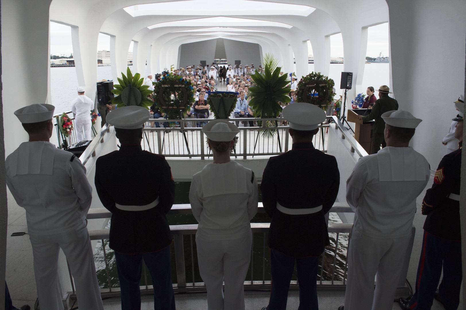 161207-N-ZK021-201 PEARL HARBOR (Dec. 7, 2016) Sailors and Marines assigned to various commands in Hawaii stand at ease during the memorial ceremony and interment service of John D. Anderson, boatswain’s mate 2nd class, and Clarendon R. Hetrick, seaman first class, at the USS Arizona Memorial. The 75th commemoration of the attack on Pearl Harbor and Oahu, co-hosted by the U.S. military, the National Park Service and the State of Hawaii, provided veterans family members, service members and the community a chance to honor the sacrifices made by those who were present Dec. 7, 1941, as well as throughout the Pacific theater. Since the attacks, the U.S. and Japan have endured more than 70 years of continued peace, a cornerstone of security and prosperity in the Indo-Asia-Pacific region. As a Pacific nation, the U.S. is committed to continue its responsibility of protecting the Pacific sea-lanes, advancing international ideals and relationships, as well as delivering security, influence and responsiveness in the region. (U.S. Navy Photo by Petty Officer 1st Class Nardel Gervacio/Released)