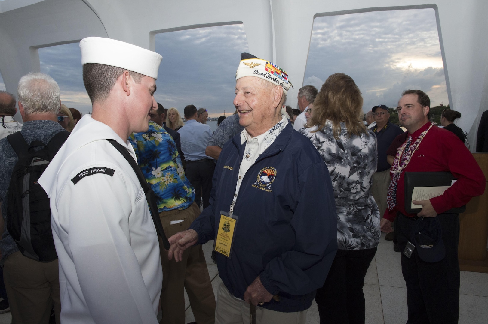 161207-N-ZK021-224 PEARL HARBOR (Dec. 7, 2016) Pearl Harbor Survivor Lewis A. Conter talks with Petty Officer 1st Class James Wolford, of Selmer, Tennessee,  following the conclusion of the memorial ceremony and interment service of John D. Anderson, boatswain’s mate 2nd class, and Clarendon R. Hetrick, seaman first class. The 75th commemoration of the attack on Pearl Harbor and Oahu, co-hosted by the U.S. military, the National Park Service and the State of Hawaii, provided veterans family members, service members and the community a chance to honor the sacrifices made by those who were present Dec. 7, 1941, as well as throughout the Pacific theater. Since the attacks, the U.S. and Japan have endured more than 70 years of continued peace, a cornerstone of security and prosperity in the Indo-Asia-Pacific region. As a Pacific nation, the U.S. is committed to continue its responsibility of protecting the Pacific sea-lanes, advancing international ideals and relationships, as well as delivering security, influence and responsiveness in the region. (U.S. Navy Photo by Petty Officer 1st Class Nardel Gervacio/Released)