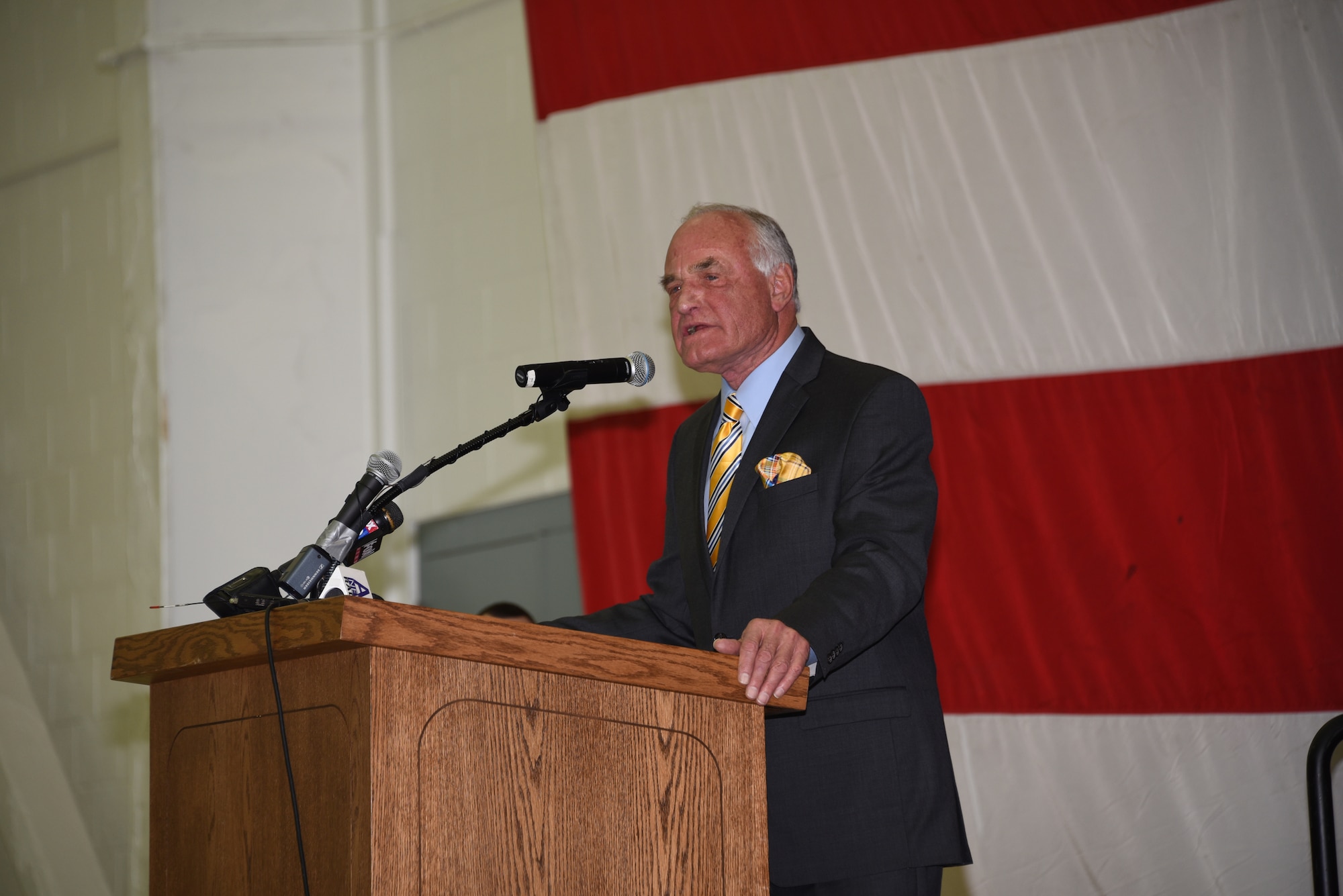 Barry Goldwater Jr. Speaks to Airman during the name dedication ceremony at the Goldwater Air National Guard Base in Phoenix, Dec. 9, 2016. Goldwater Air National Guard Base is new name of the formerly known Sky Harbor Air National Guard Base. (U.S. Air National Guard photo by Technical Sgt. Michael Matkin)