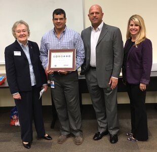 (From Left to Right) Caryl Hill, ESGR representative, Mike Caraballo, Chari, San Antonio, TX Chapter of the Veterans’ Team Member Network (VTMN-San Antonio) and commander of the 166th Regional Support Group on Fort Buchanan, Puerto Rico, Gui Kahl Senior Vice President Wells Fargo, and Amber Fencl, Vice President Wells Fargo, pose for a photo after Caraballo is presented with the ESGR Seven Seals Award on December 7, in San Antonio, Texas.