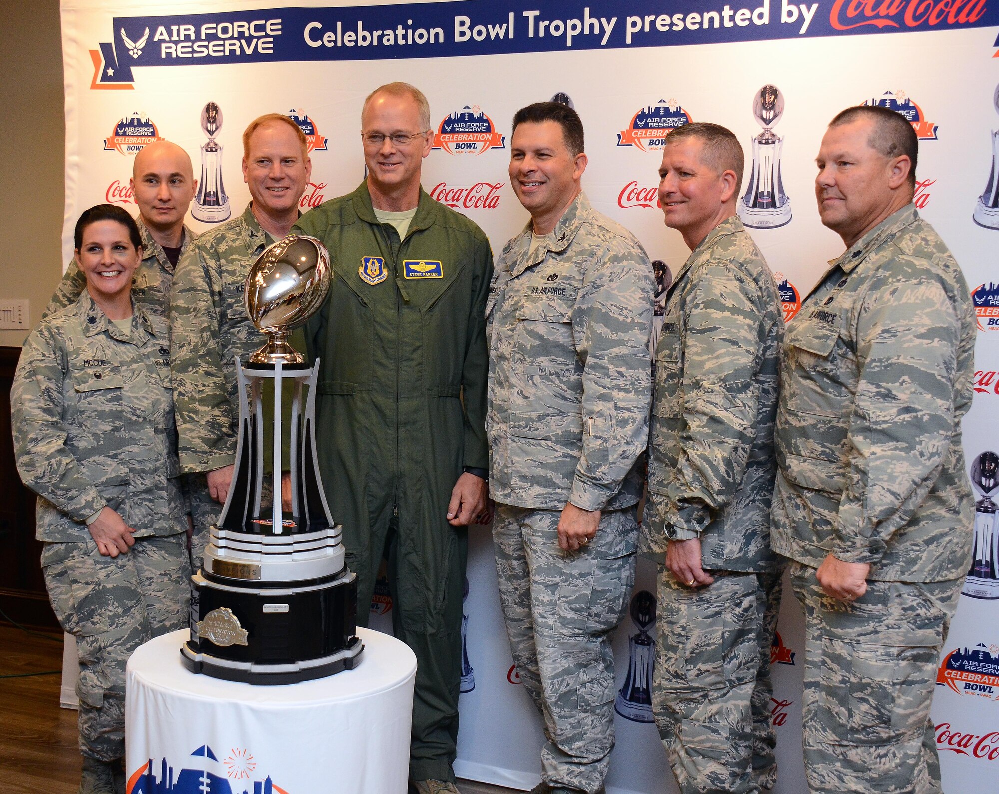 Brig. Gen. Steven Parker, 94th Airlift Wing commander (center), along with members of Dobbins Leadership take center stage with the U.S. Air Force Reserve Celebration Bowl trophy at Dobbins Air Reserve Base, Ga. Dec. 9, 2016.  The North Carolina Central University Eagles and the Gambling State Tigers are slated to go head-to-head in the bowl game on Dec. 17th. (U.S. Air Force photo/Don Peek)