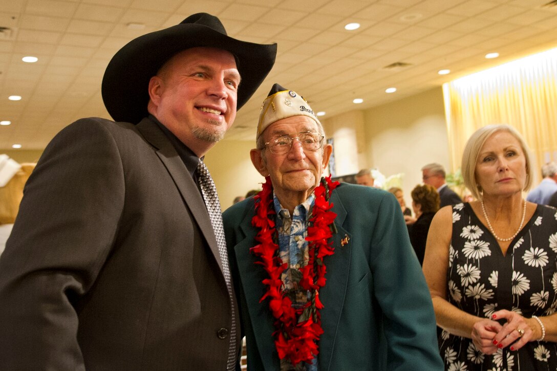 Pearl Harbor survivor and Navy vet Milton Mapou meets country singer and songwriter Garth Brooks at a gala for the survivors of the Pearl Harbor attack in Honolulu, Hawaii, Dec. 6, 2016. Mapou, who served on the USS Detroit during Pearl Harbor, was in Hawaii for commemorations of the 75th anniversary of the Dec. 7, 1941, attack. DoD photo by Lisa Ferdinando