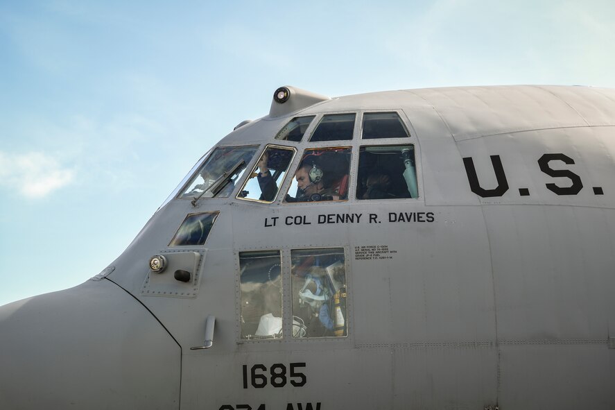 Captain Bryan Gibbs, 36th Airlift Squadron C-130H Hercules pilot, prepares his aircraft for takeoff during Operation Christmas Drop at Andersen Air Force Base, Guam, Dec. 7, 2016. C-130 Hercules air crews and maintainers came to Andersen from the U.S. Air Force, the Japan Self Defense Force and the Royal Australian Air Force to train together by delivering 140 parachute bundles of donated supplies to the Micronesian Islands. (U.S. Air Force photo by Senior Airman Elizabeth Baker/Released)