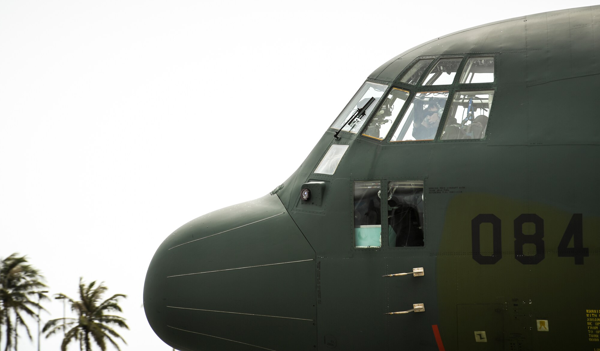 A C-130H Hercules pilot with the Japan Self Defense Force taxis before takeoff at Andersen Air Force Base, Guam, Dec. 7, 2016. The Japan Self Defense Force sent a C-130J to OCD to train with the 36th Airlift Squadron and the Royal Australian Air Force, helping participants understand each other’s techniques and giving them a chance to offer each other insight. Bilateral training improves participants’s abilities to work together during real world scenarios, such as delivering disaster relief supplies. (U.S. Air Force photo by Senior Airman Elizabeth Baker/Released)